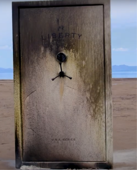 Rustic wooden door with 'Liberty' engraving in a desert setting
