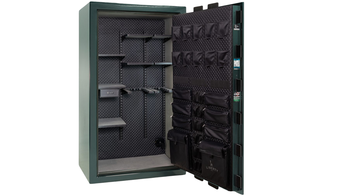 Open Liberty safe interior showing the ProFlex shelving layout and door organizer panel